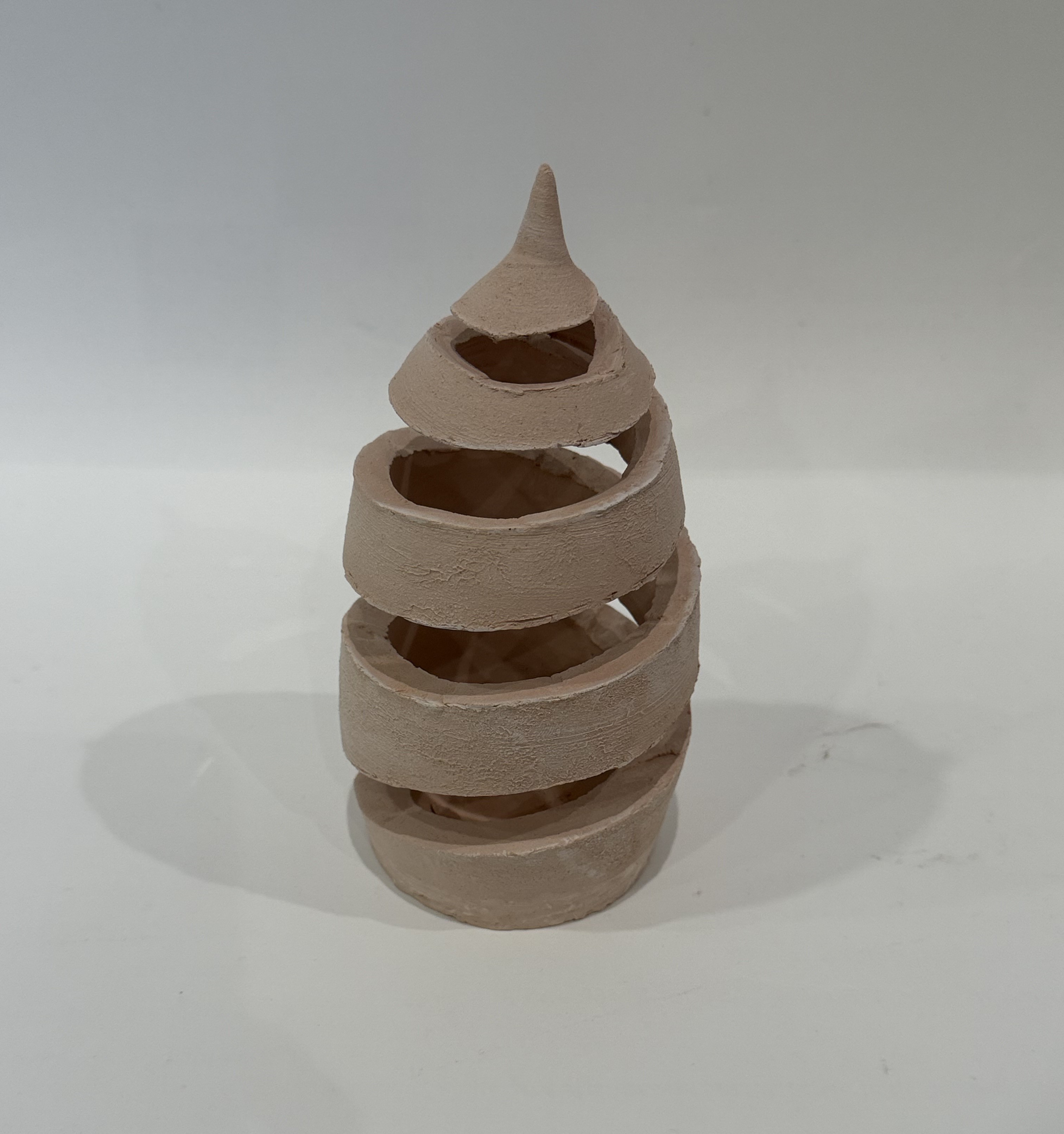 An unfired spiral coil form