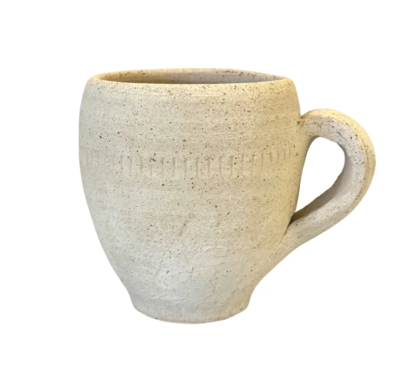 A porous bisque-fired pot beside a glazed one